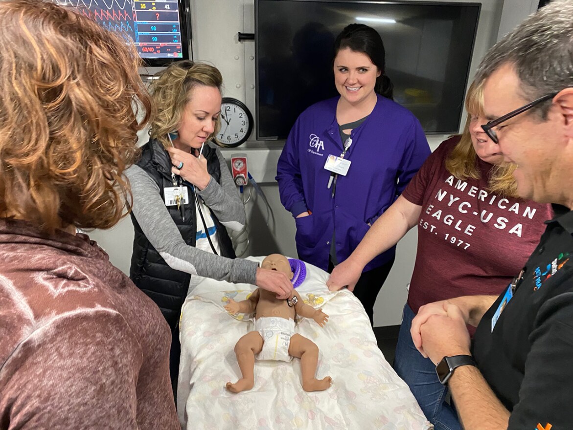 (L to R) Dusty Mikalatos, Angie Davis, Peyton Nelson, and Tamara Nichols, OBRNs from Community Hospital of Anaconda take part in a medical simulation training. Joe Poole of Best Practice Medicine looks on.